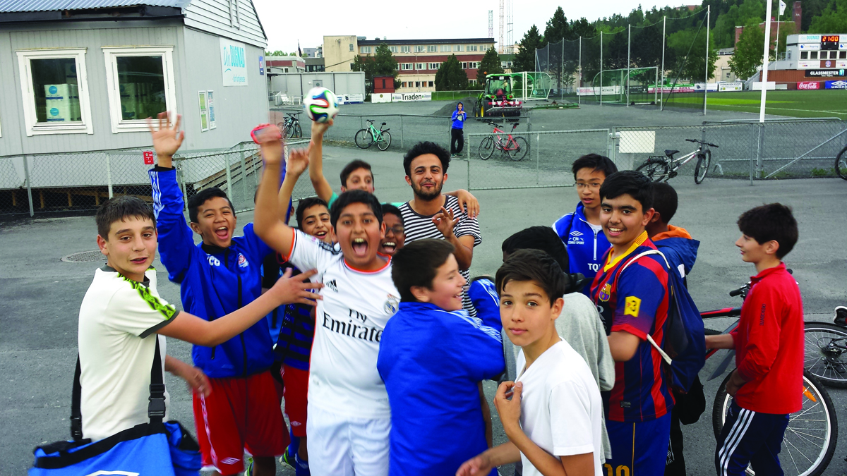 Copa90 presenter Eli Mengem is mobbed by excited kids in Norway. Photo by Lawrence Tallis for Copa90