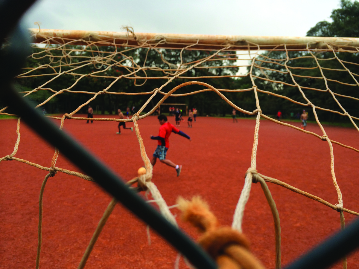 Kids playing football in Ibirapuera Park, Sao Paulo. Photo by Tom Mallion for Copa90.