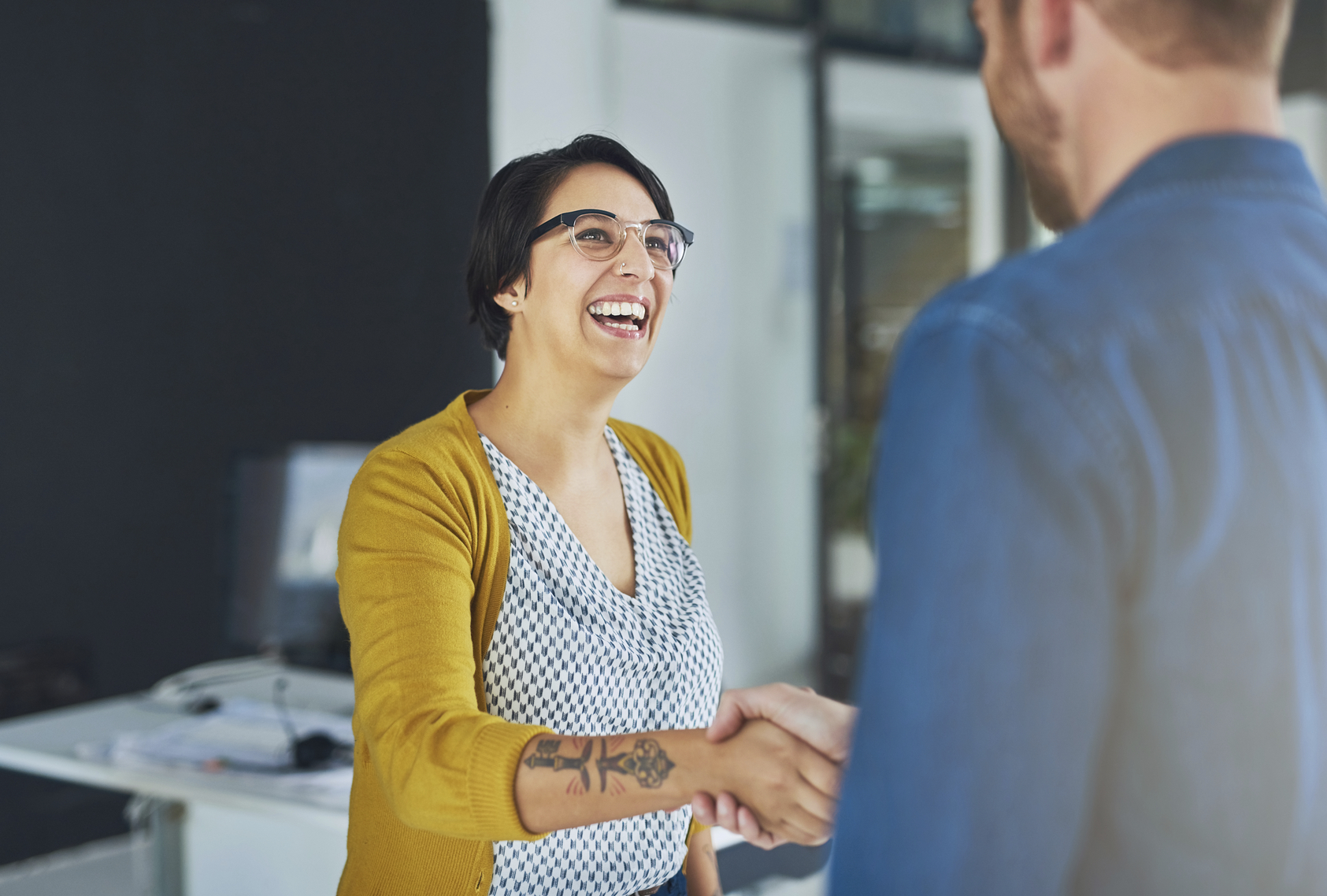 Cropped shot of businesspeople shaking hands in an office