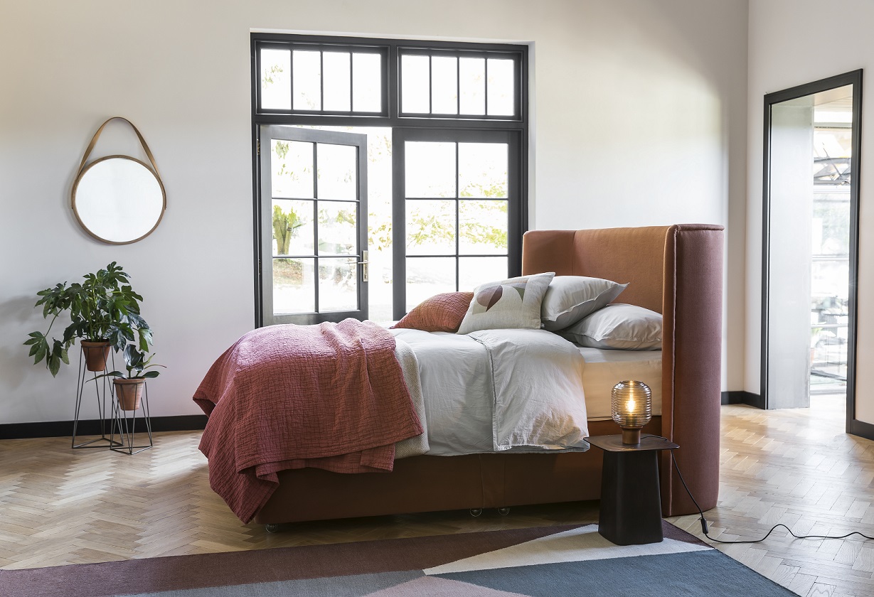 heals monroe bed near window with mirror